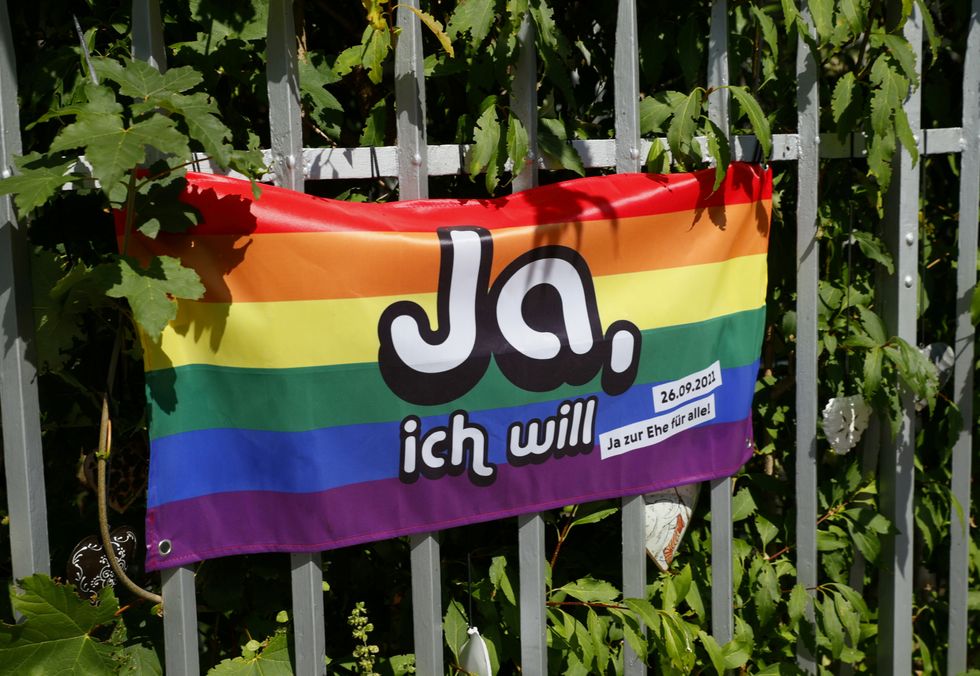 A flag pictured ahead of a vote on same-sex marriage in Bern, Switzerland. Flag reads: 'Yes, I will'.