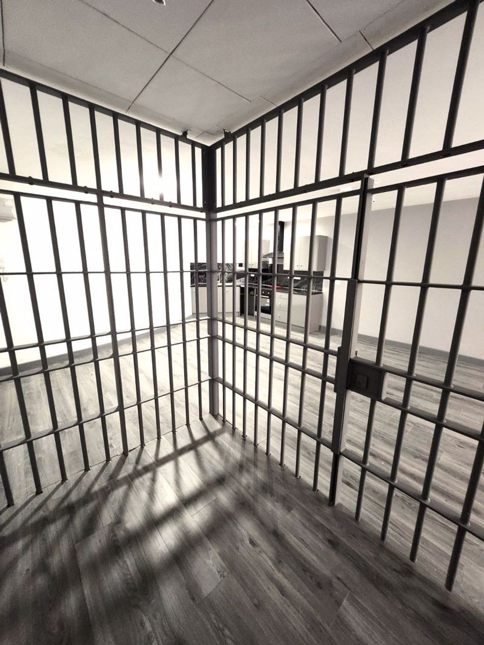 A flat has a prison cell in its living room