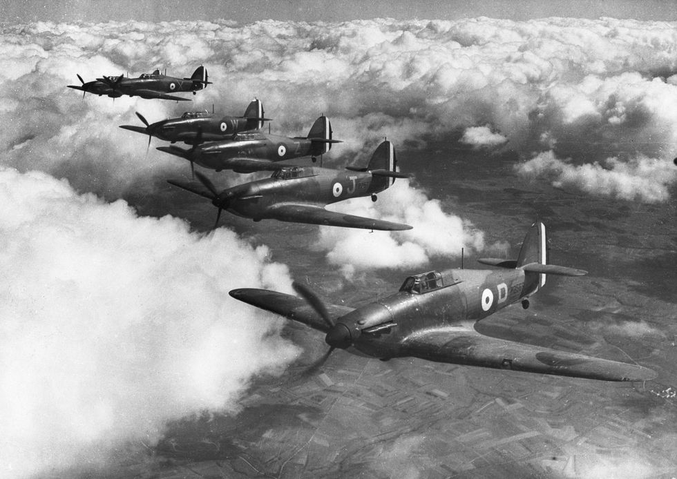 A flight of Hawker Hurricane MkI monoplane fighters of No73 Squadron Royal Air Force join up into a close echelon starboard formation on patrol over France