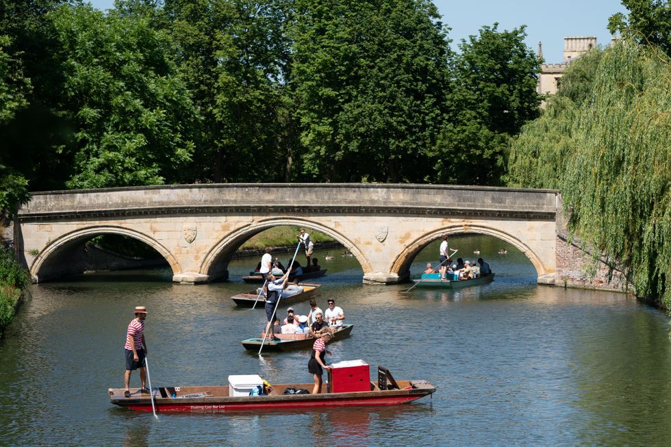 A floating bar serves drinks to punters along the River Cam in Cambridge. Picture date: Friday July 16, 2021.