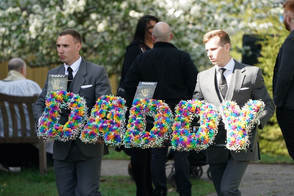 A floral tribute is carried into St Francis of Assisi church ahead of the funeral of The Wanted star Tom Parker in Queensway, Petts Wood, in south-east London, following his death at the age of 33 last month, 17 months after being diagnosed with an inoperable brain tumour. Picture date: Wednesday April 20, 2022.