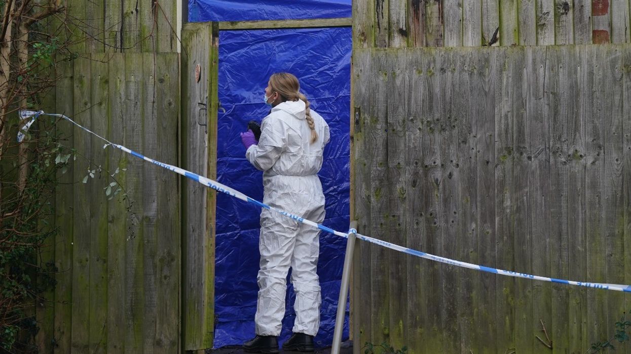 A forensic investigator at the scene on Fownhope Close in Redditch