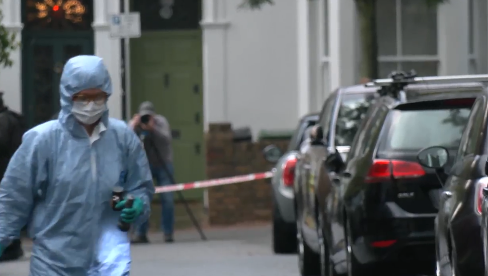 A forensic officer at the scene of the blaze