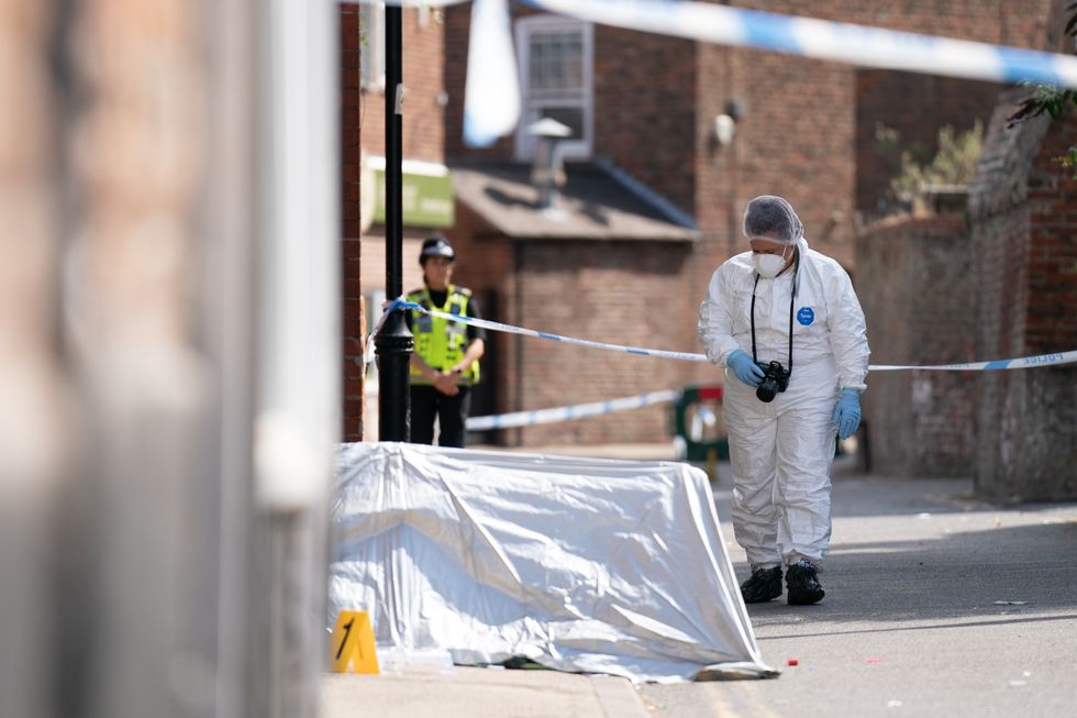 A forensic officer near the scene in Boston