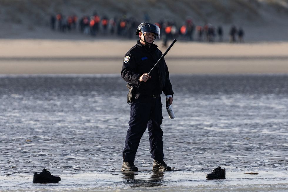 A French national police officer off the beach of Gravelines, northern France