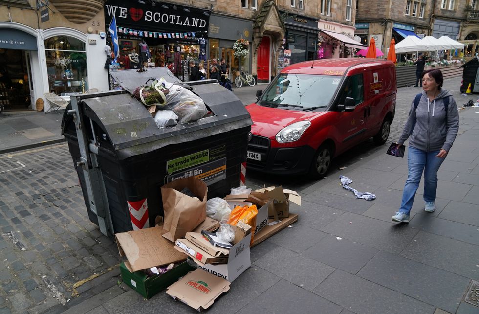 A full bin in Cockburn Street in Edinburgh. Cleansing workers at the City of Edinburgh Council will begin eleven days of strike action. Picture date: Thursday August 18, 2022.