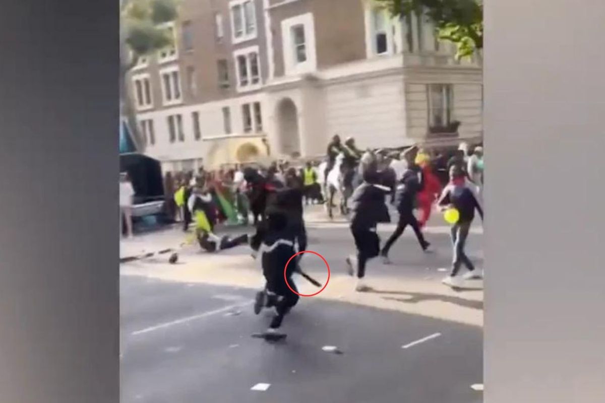 A gang of youths were spotted running away from the scene at Notting Hill Carnival with one holding a suspected machete after eight people were stabbed