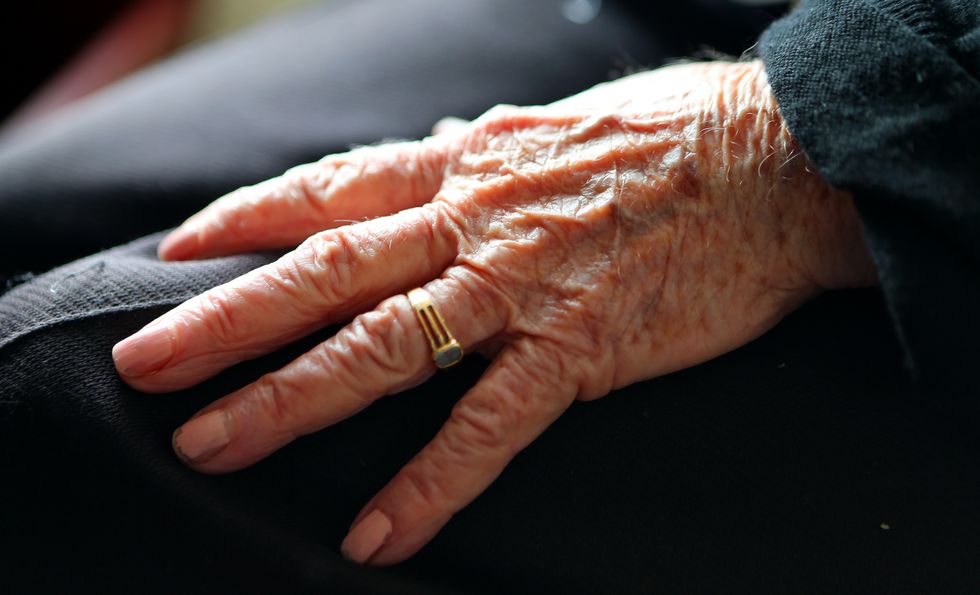 A general view of a close up of the left hand of an elderly woman at home.
