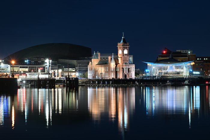 A general view of Cardiff Bay at night showing the Pierhead Building (C) and Senedd (R), home of the Welsh Parliament