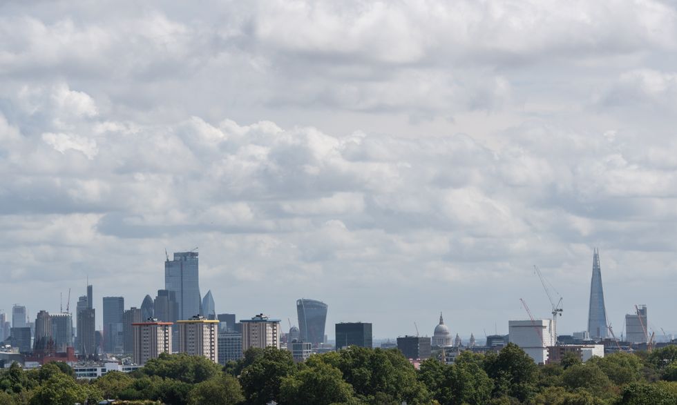 A general view of cloudy skies over central London from Primrose Hill, as blustery showers are expected across the UK over the next few days, while hopes of a Bank Holiday heatwave have been dashed by forecasters.