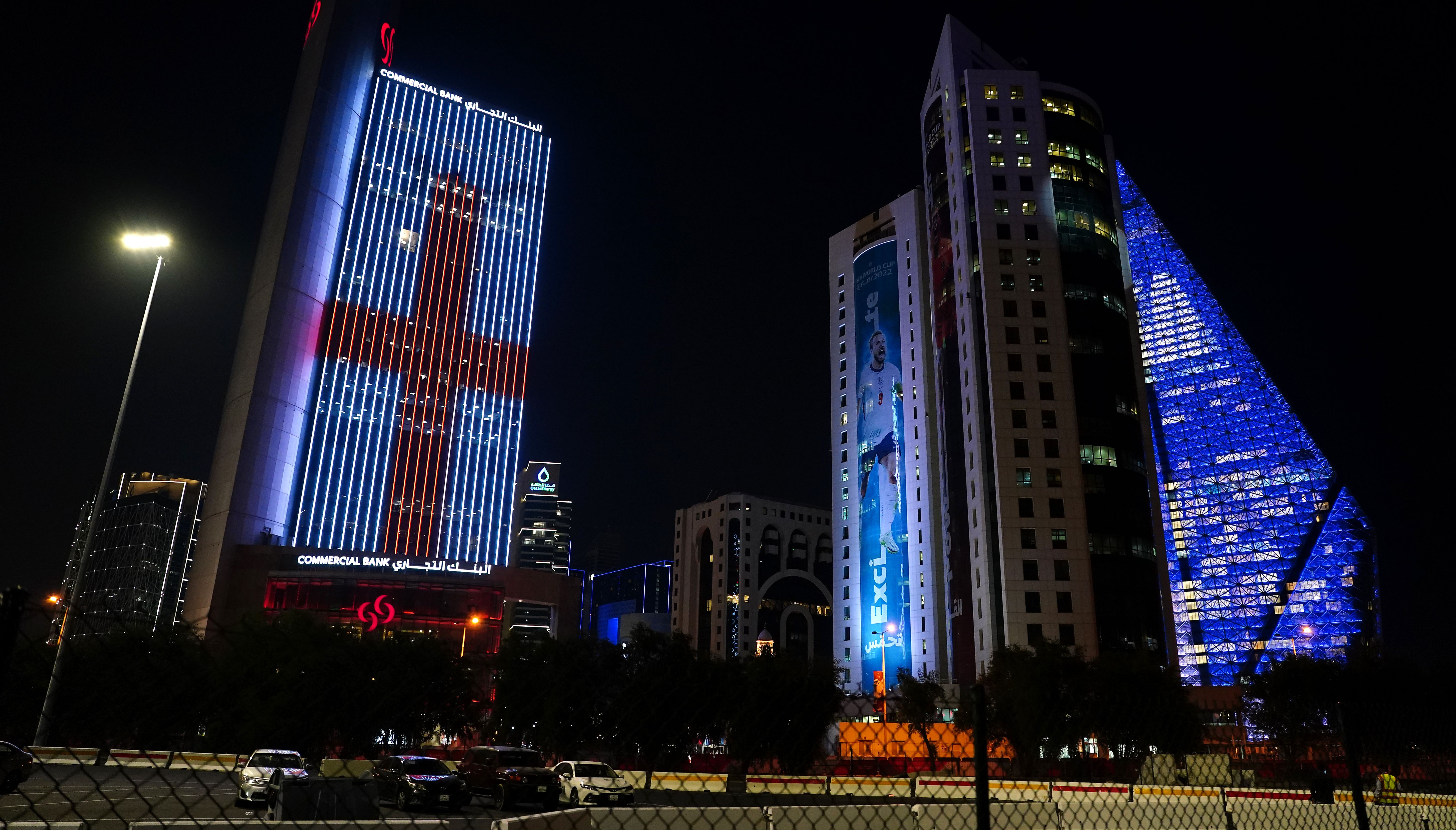 A general view of the Doha skyline featuring a building with an England flag lit up and an advert featuring Harry Kane ahead of the FIFA World Cup 2022 in Qatar.