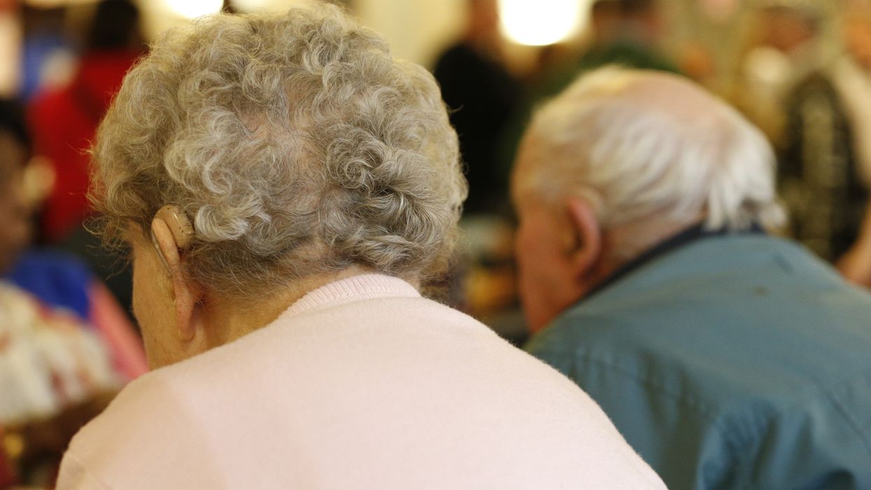 A generic image of elderly people at a charity tea party in London