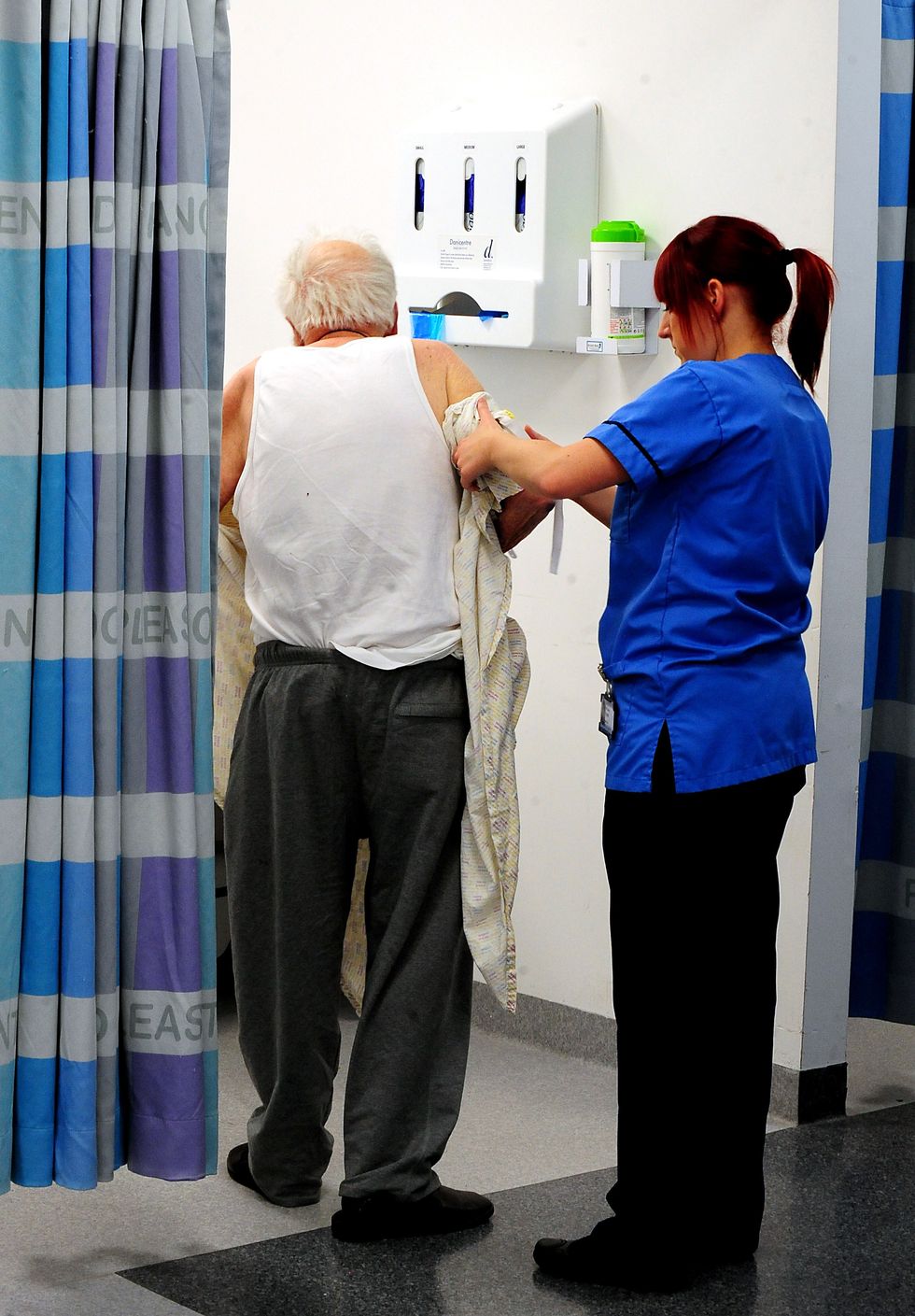 A generic stock photo of a nurse helping an elderly patient at Queen Elizabeth Hospital, Birmingham