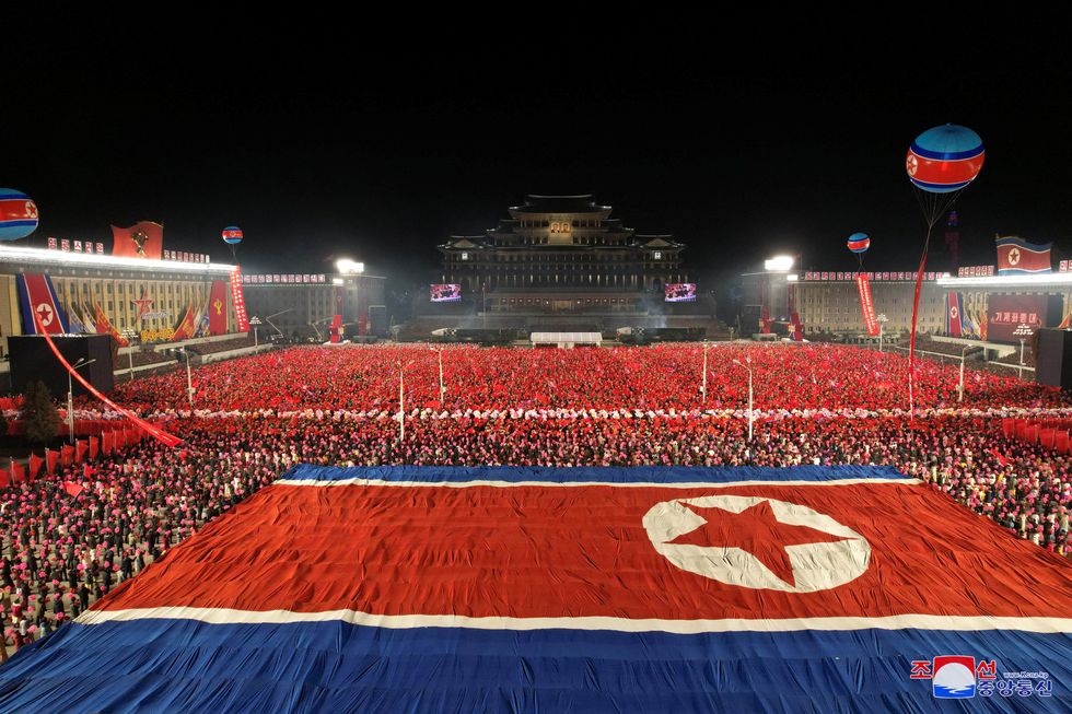 A giant North Korean national flag is displayed during a military parade to mark the 75th founding anniversary of North Korea's army, at Kim Il Sung Square in Pyongyang, North Korea February 8, 2023, in this photo released by North Korea's Korean Central News Agency (KCNA).    KCNA via REUTERS    ATTENTION EDITORS - THIS IMAGE WAS PROVIDED BY A THIRD PARTY. REUTERS IS UNABLE TO INDEPENDENTLY VERIFY THIS IMAGE. NO THIRD PARTY SALES. SOUTH KOREA OUT. NO COMMERCIAL OR EDITORIAL SALES IN SOUTH KOREA.