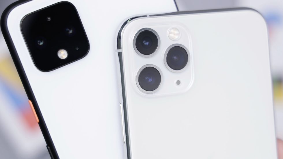 a google pixel android phone is pictured behind an iphone 