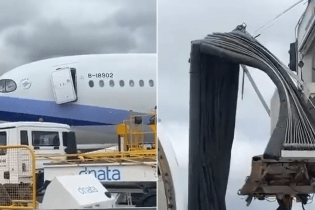 A grounded plane has smashed a door into an aerobridge after it rolled backwards while on the runway
