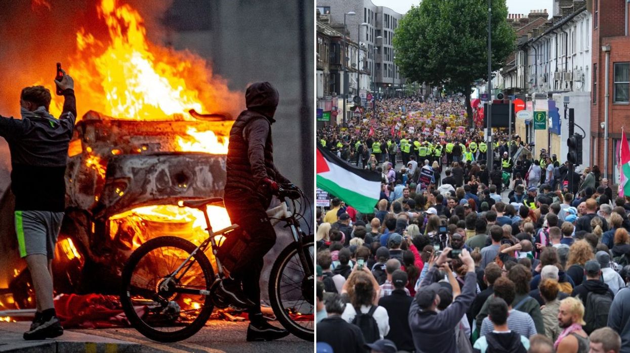 A group of counter protestors and two men in front of a burning vehicle