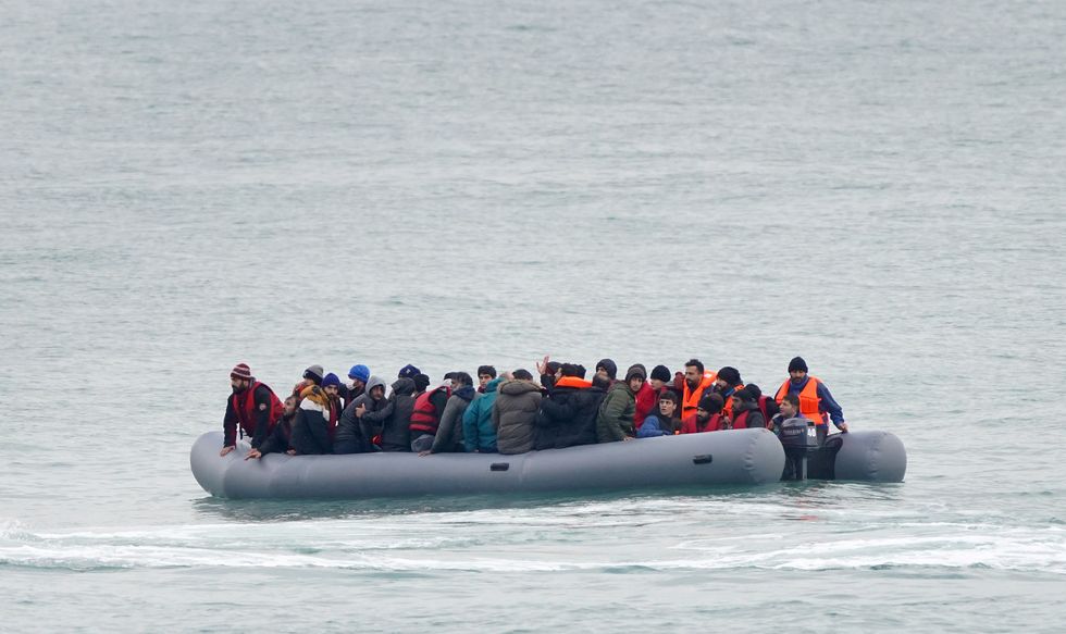 A group of people thought to be migrants adrift in a dinghy before being rescued off the coast of Folkestone, Kent, as small boat incidents in the Channel continue