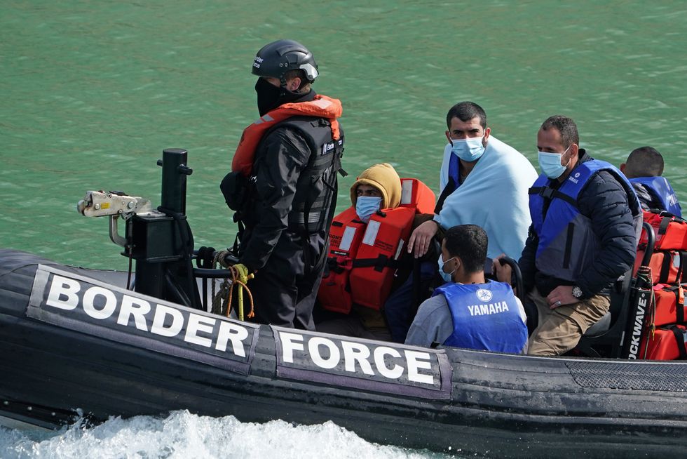 A group of people thought to be migrants are brought in to Dover, Kent, by a Border Force patrol boat following a small boat incident in the Channel. Picture date: Monday September 13, 2021.