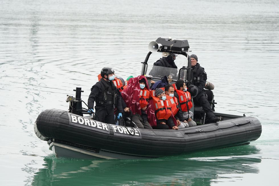 A group of people thought to be migrants are brought in to Dover, Kent, by a Border Force vessel
