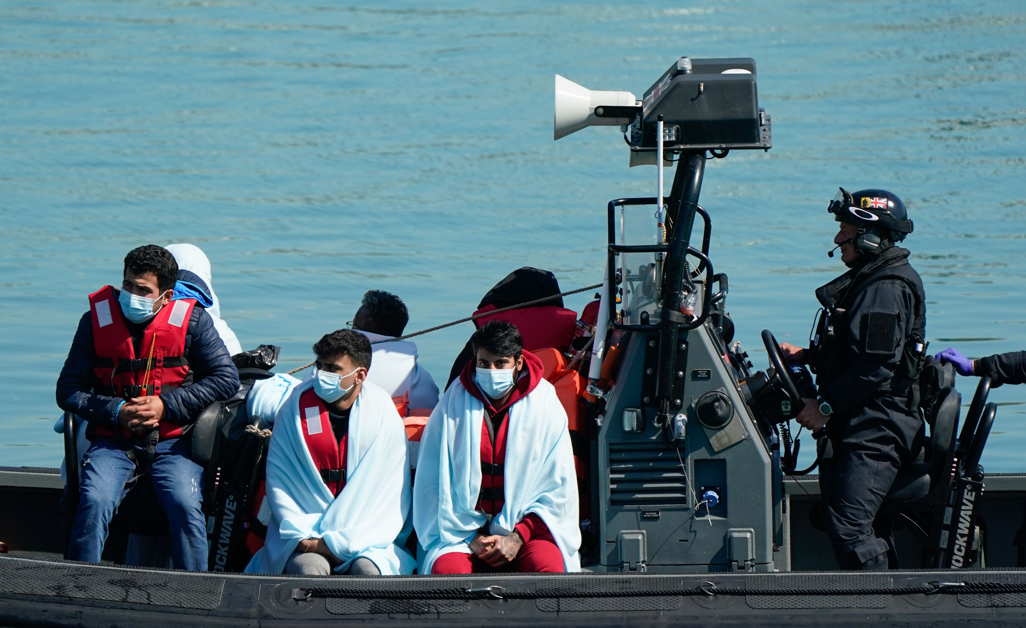 A group of people thought to be migrants are brought in to Dover, Kent, following a small boat incident in the Channel