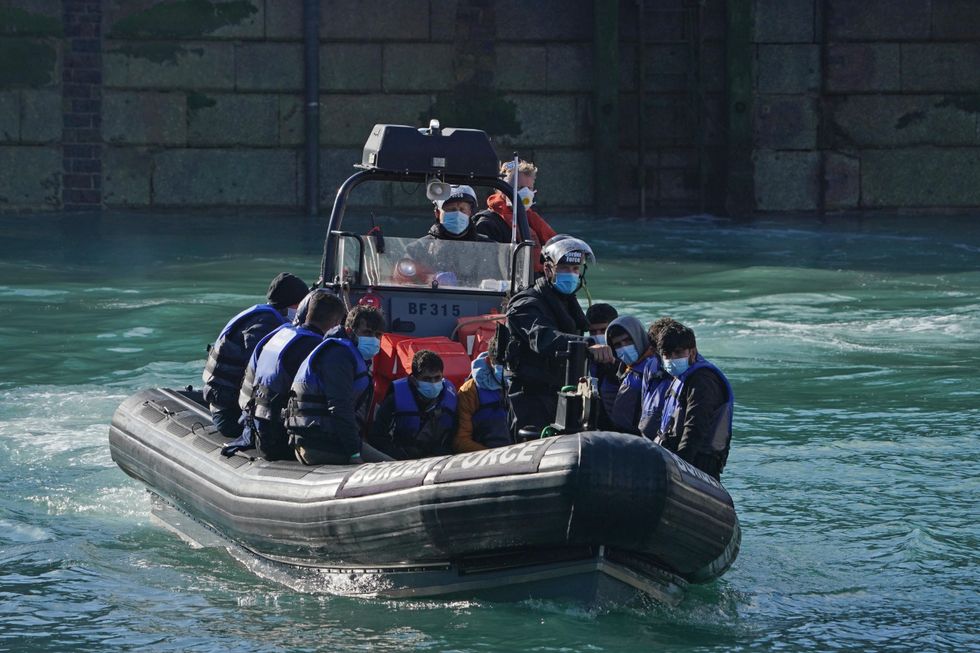 A group of people thought to be migrants are brought in to Dover, Kent, following a small boat incident in the Channel.