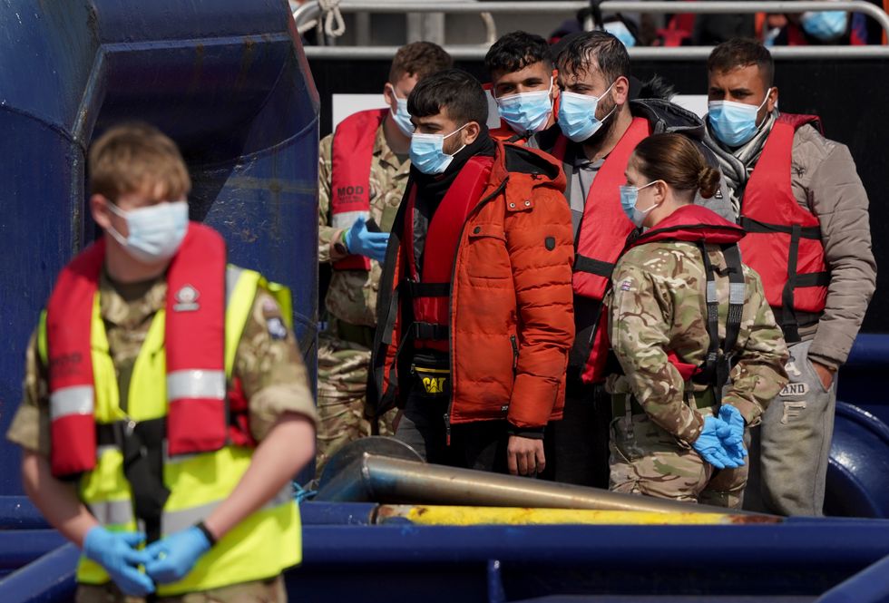 A group of people thought to be migrants are brought in to Dover, Kent, following a small boat incident in the Channel.