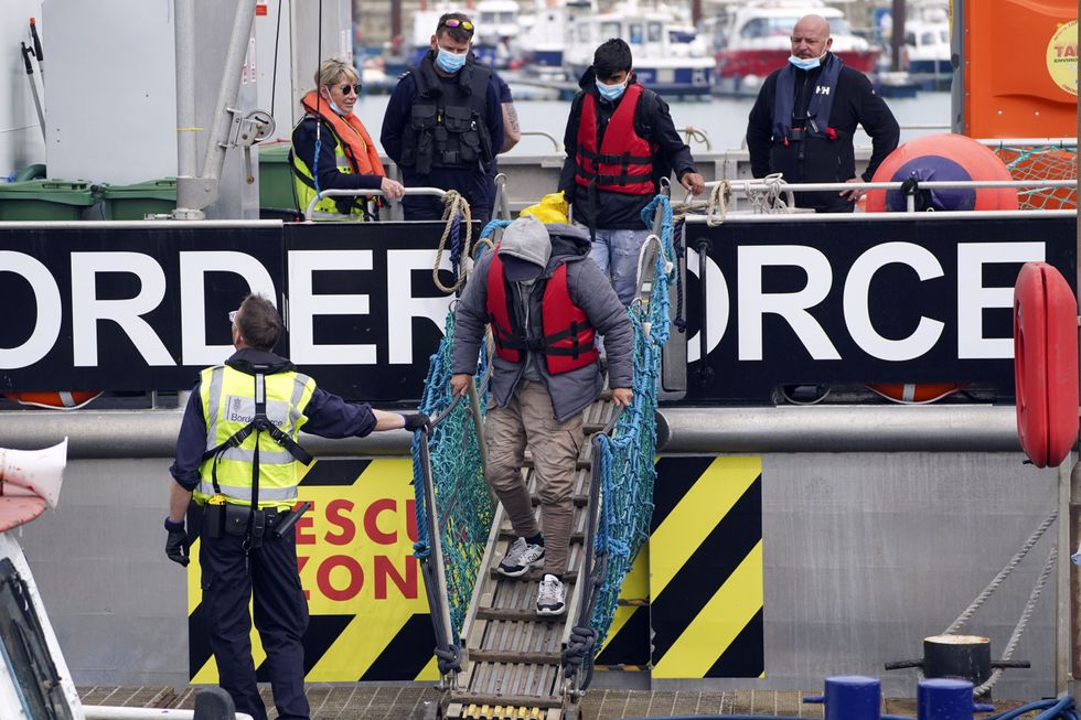 A group of people thought to be migrants are brought in to Dover, Kent, following a small boat incident in the Channel.