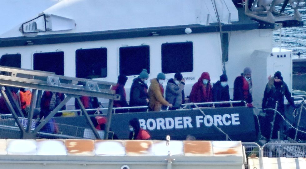 A group of people thought to be migrants are brought in to Dover, Kent, onboard a Border Force vessel, following a small boat incident in the Channel. Picture date: Monday January 2, 2023.