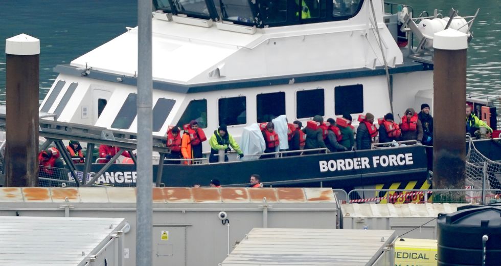 A group of people thought to be migrants are brought in to Dover, Kent, onboard a Border Force vessel, following a small boat incident in the Channel. Picture date: Wednesday January 25, 2023.