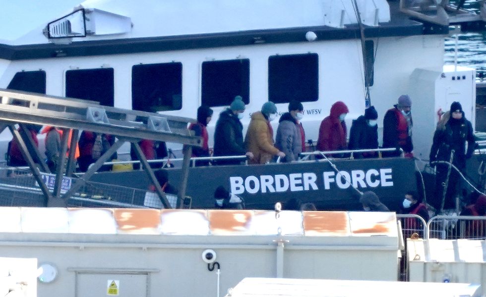 A group of people thought to be migrants are brought in to Dover, Kent, onboard a Border Force vessel, following a small boat incident in the Channel. Picture date: Monday January 2, 2023.