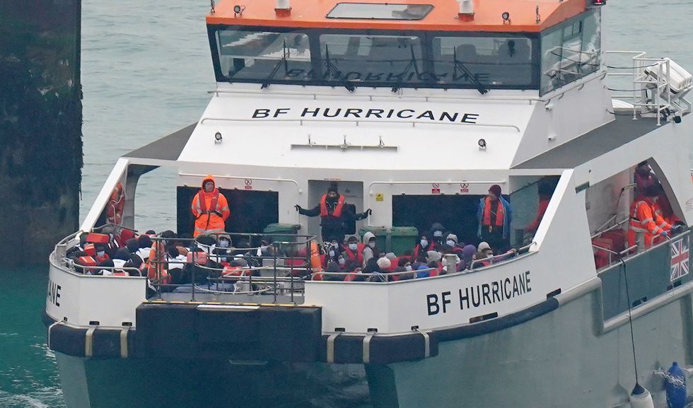 A group of people thought to be migrants are brought in to Dover, Kent, onboard a Border Force vessel following a small boat incident in the Channel. Picture date: Monday November 14, 2022.