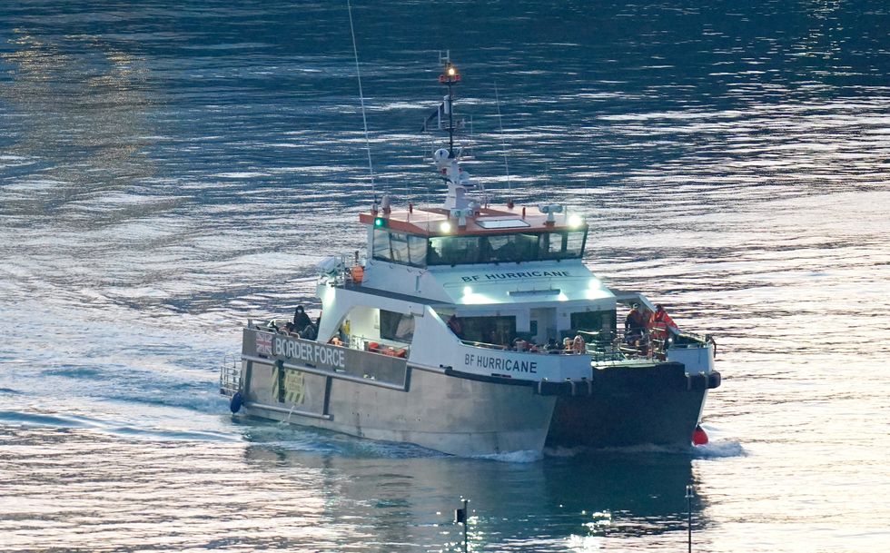 A group of people thought to be migrants are brought in to Dover, Kent, onboard a Border Force vessel following a small boat incident in the Channel. Picture date: Saturday November 12, 2022.