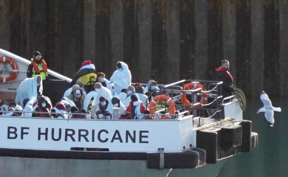 A group of people thought to be migrants are brought in to Dover, Kent, onboard a Border Force vessel following a small boat incident in the Channel. Picture date: Monday November 28, 2022.