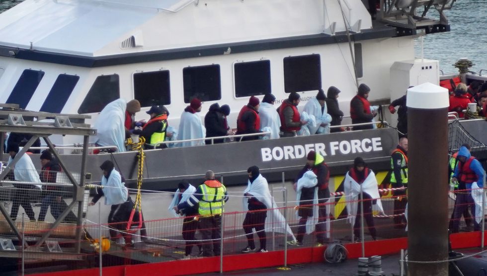 A group of people thought to be migrants are brought in to Dover, Kent, onboard a Border Force vessel following a small boat incident in the Channel. Picture date: Monday November 28, 2022.
