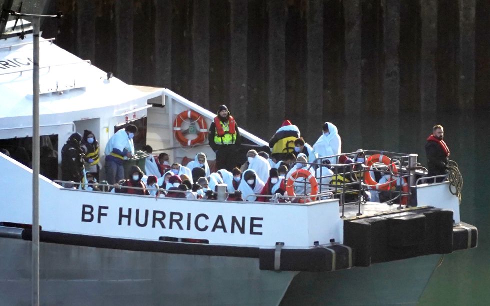 A group of people thought to be migrants are brought in to Dover, Kent, onboard a Border Force vessel following a small boat incident in the Channel. Picture date: Monday November 28, 2022.