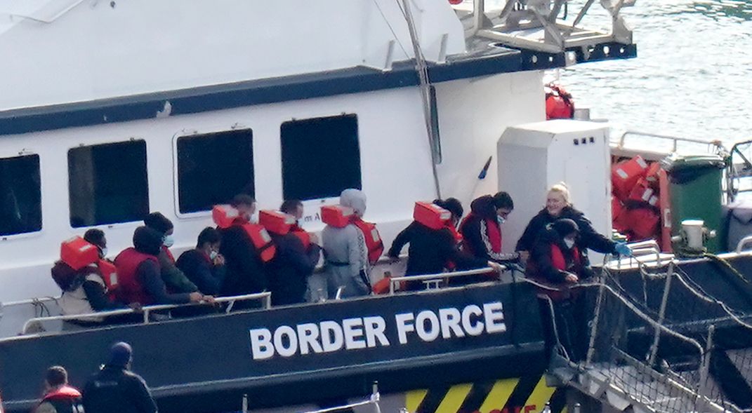 A group of people thought to be migrants are brought in to Dover, Kent, onboard a Border Force vessel following a small boat incident in the Channel. Picture date: Friday October 14, 2022.