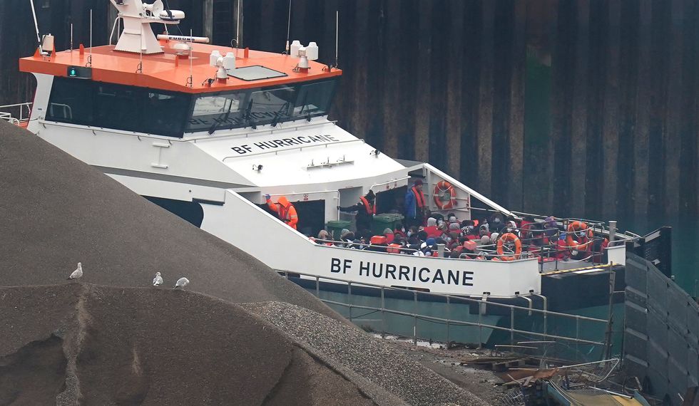 A group of people thought to be migrants are brought in to Dover, Kent, onboard a Border Force vessel following a small boat incident in the Channel. Picture date: Monday November 14, 2022.