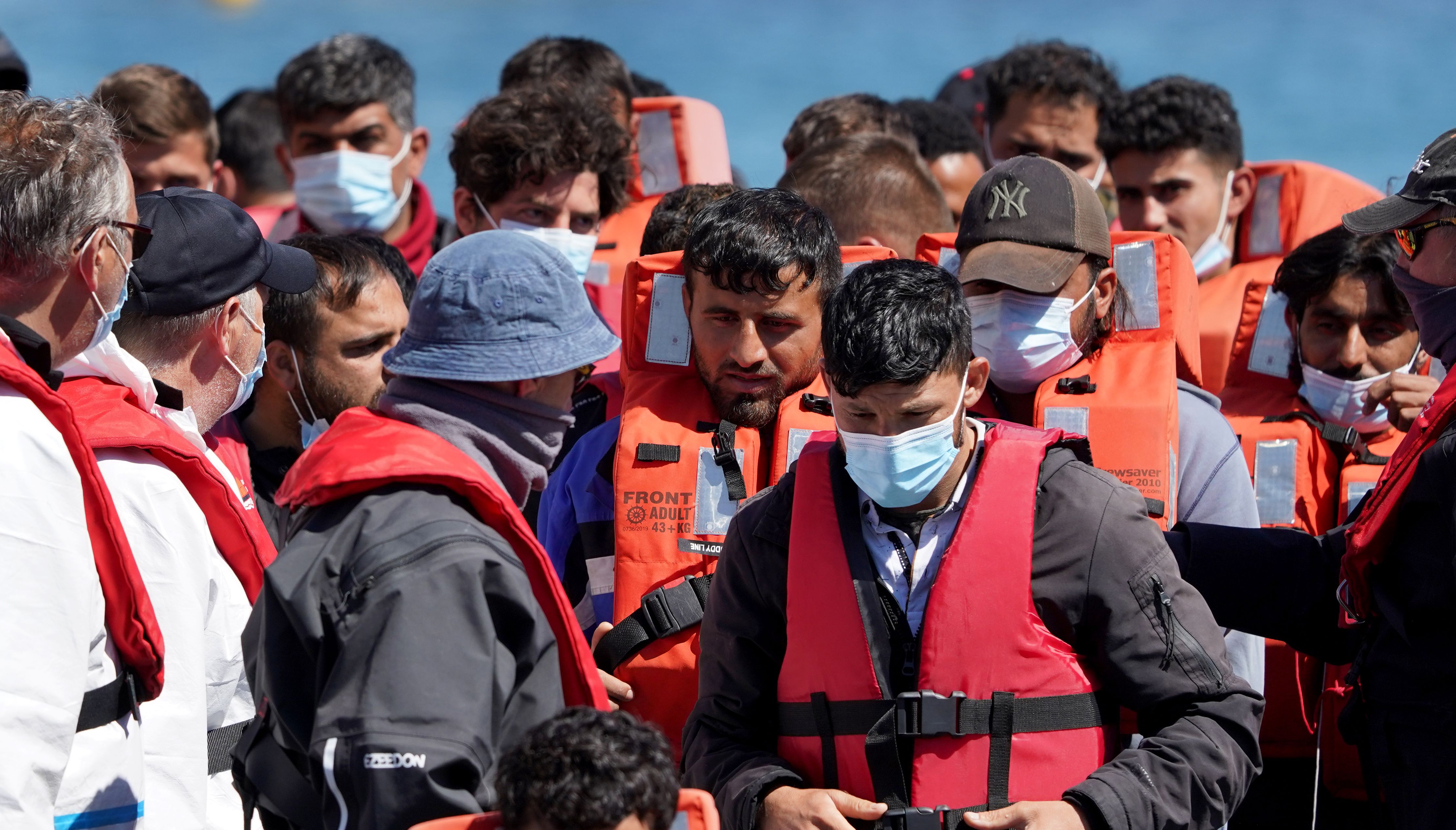A group of people thought to be migrants are brought in to Dover, Kent, onboard a Border Force vessel following a small boat incident in the Channel. Picture date: Monday July 11, 2022.