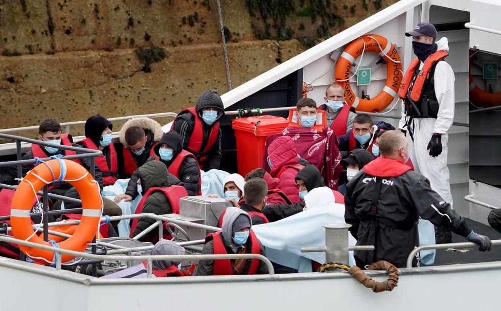 A group of people thought to be migrants are brought in to Dover, Kent, onboard a Border Force vessel following a small boat incident in the Channel