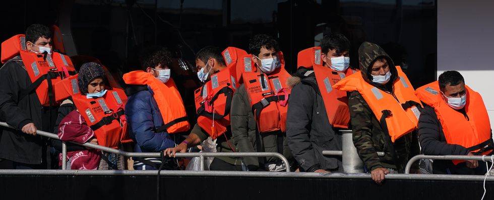 A group of people thought to be migrants are brought in to Dover, Kent, onboard a Border Force vessel