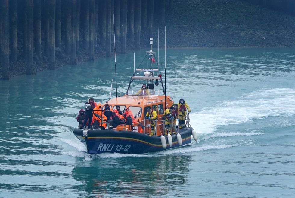 A group of people thought to be migrants are brought in to Dover, Kent, onboard an RNLI vessel following a small boat incident in the Channel. Picture date: Friday March 4, 2022.