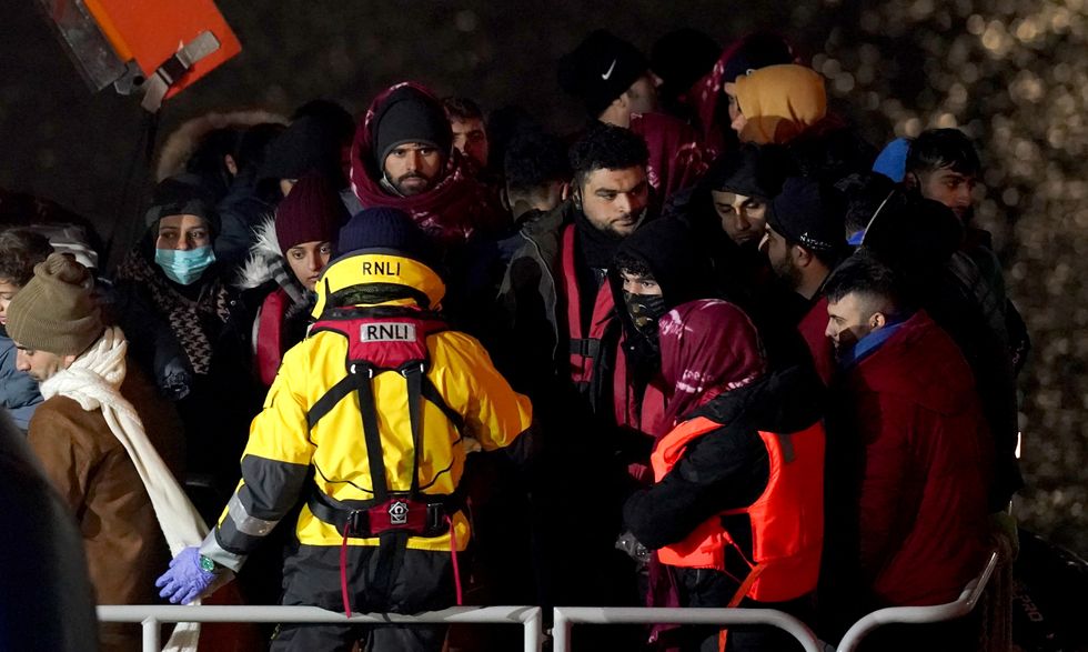 A group of people thought to be migrants are brought in to Dover, Kent, onboard the Dover lifeboat, following a small boat incident in the Channel. Picture date: Saturday January 15, 2022.