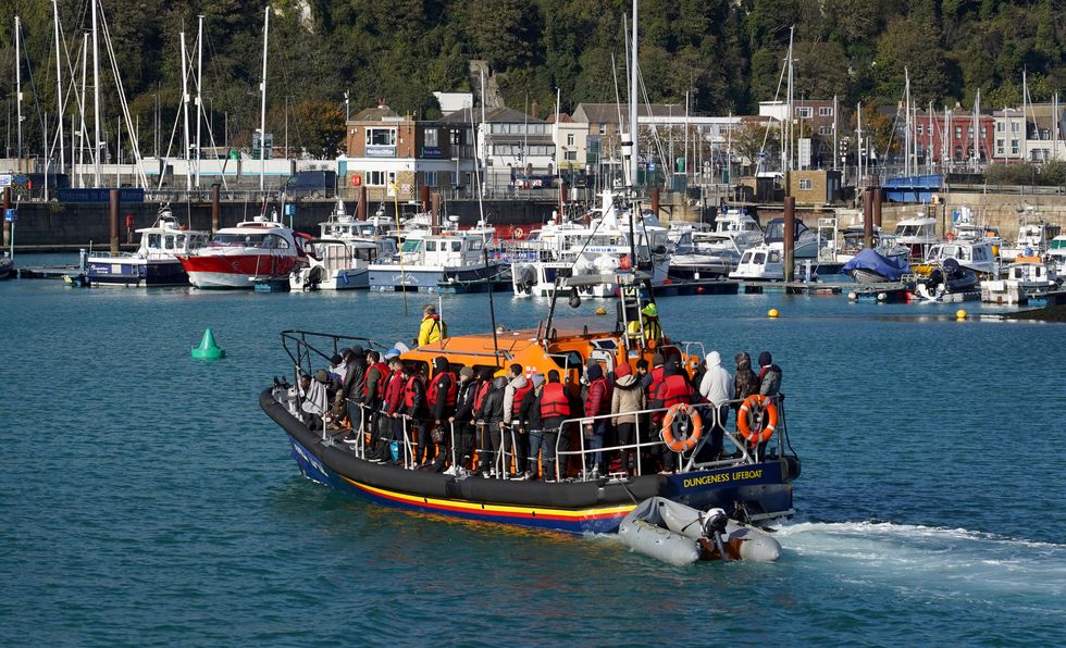 A group of people thought to be migrants are brought in to Dover, Kent, onboard the Dungeness Lifeboat following a small boat incident in the Channel.