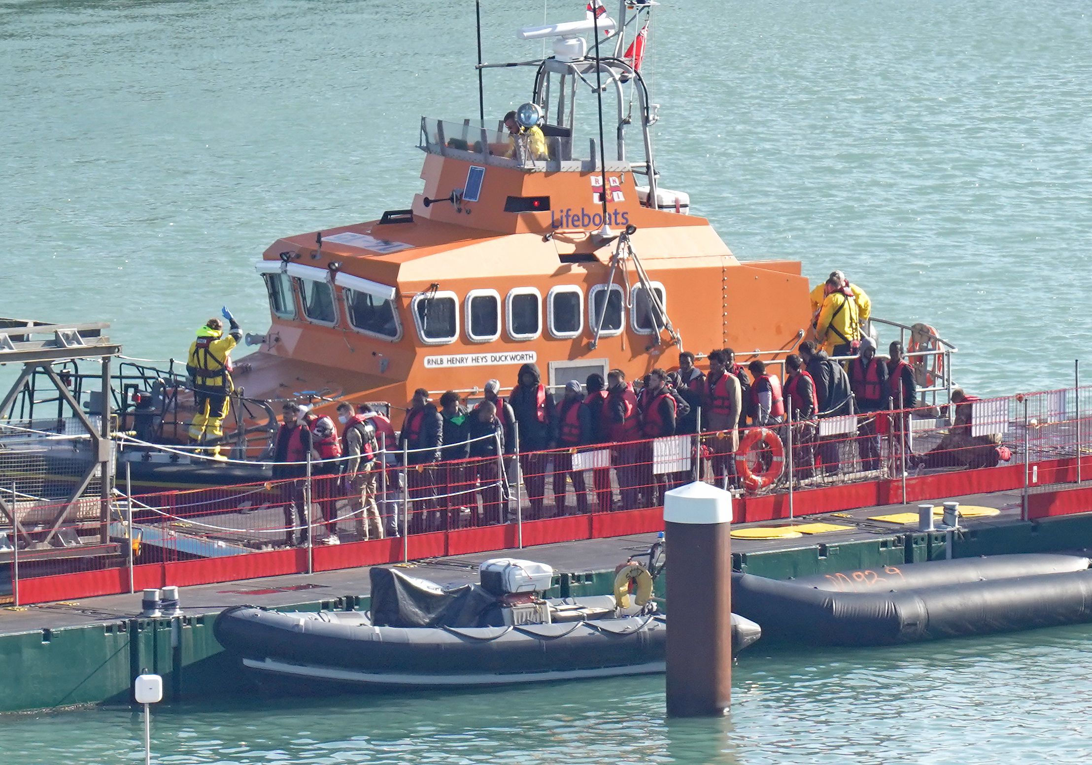 A group of people thought to be migrants are brought in to Dover, Kent, onboard the Ramsgate Lifeboat following a small boat incident in the Channel. Picture date: Thursday October 27, 2022.