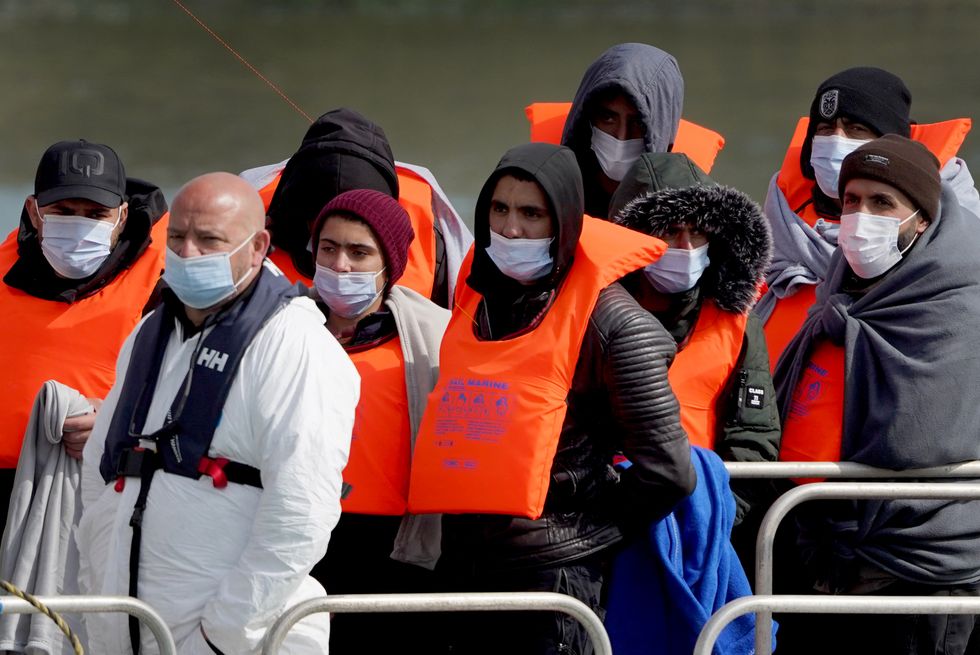 A group of people thought to be migrants are brought in to Dover, Kent