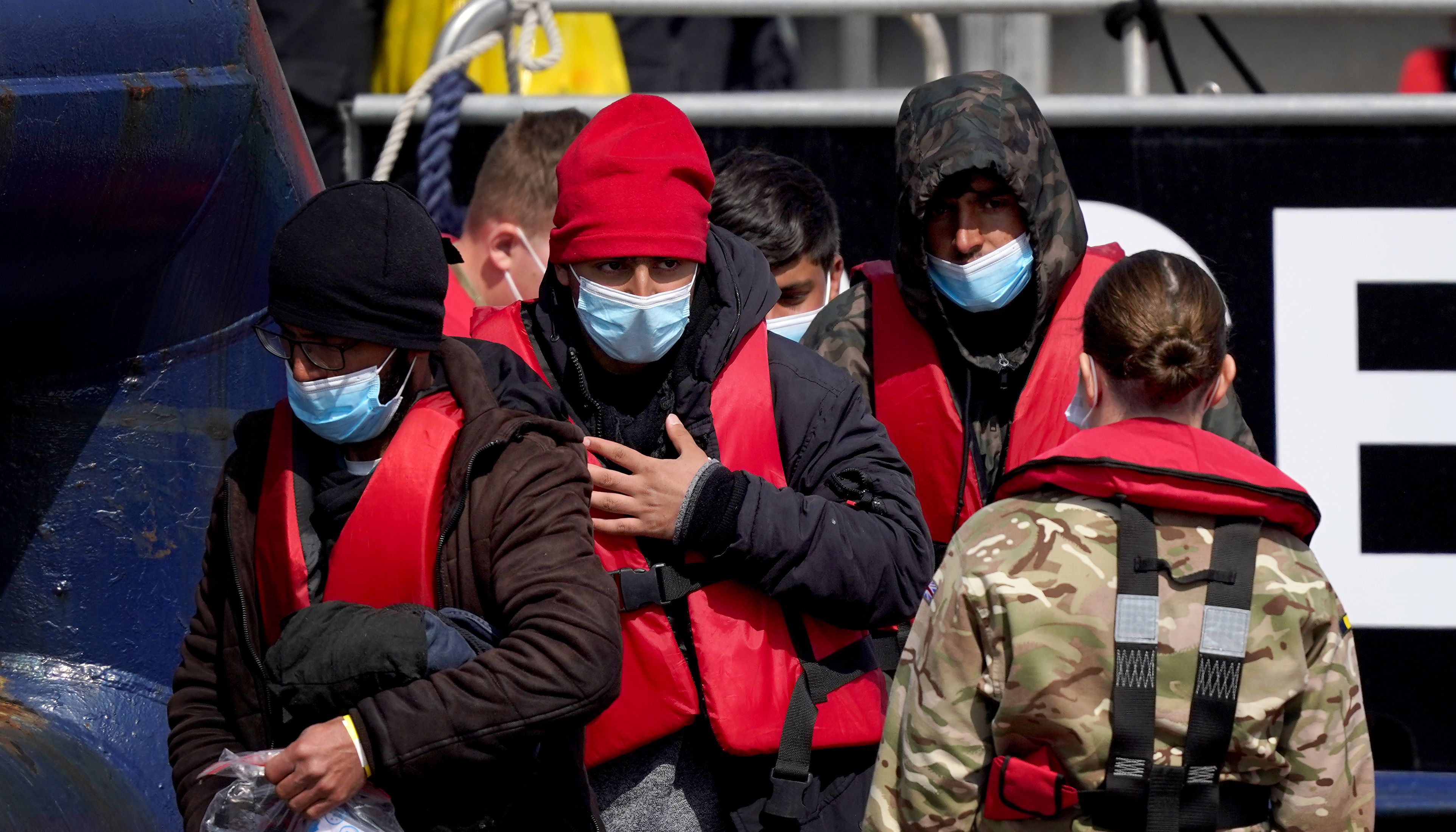 A group of people thought to be migrants are brought in to Dover, Kent