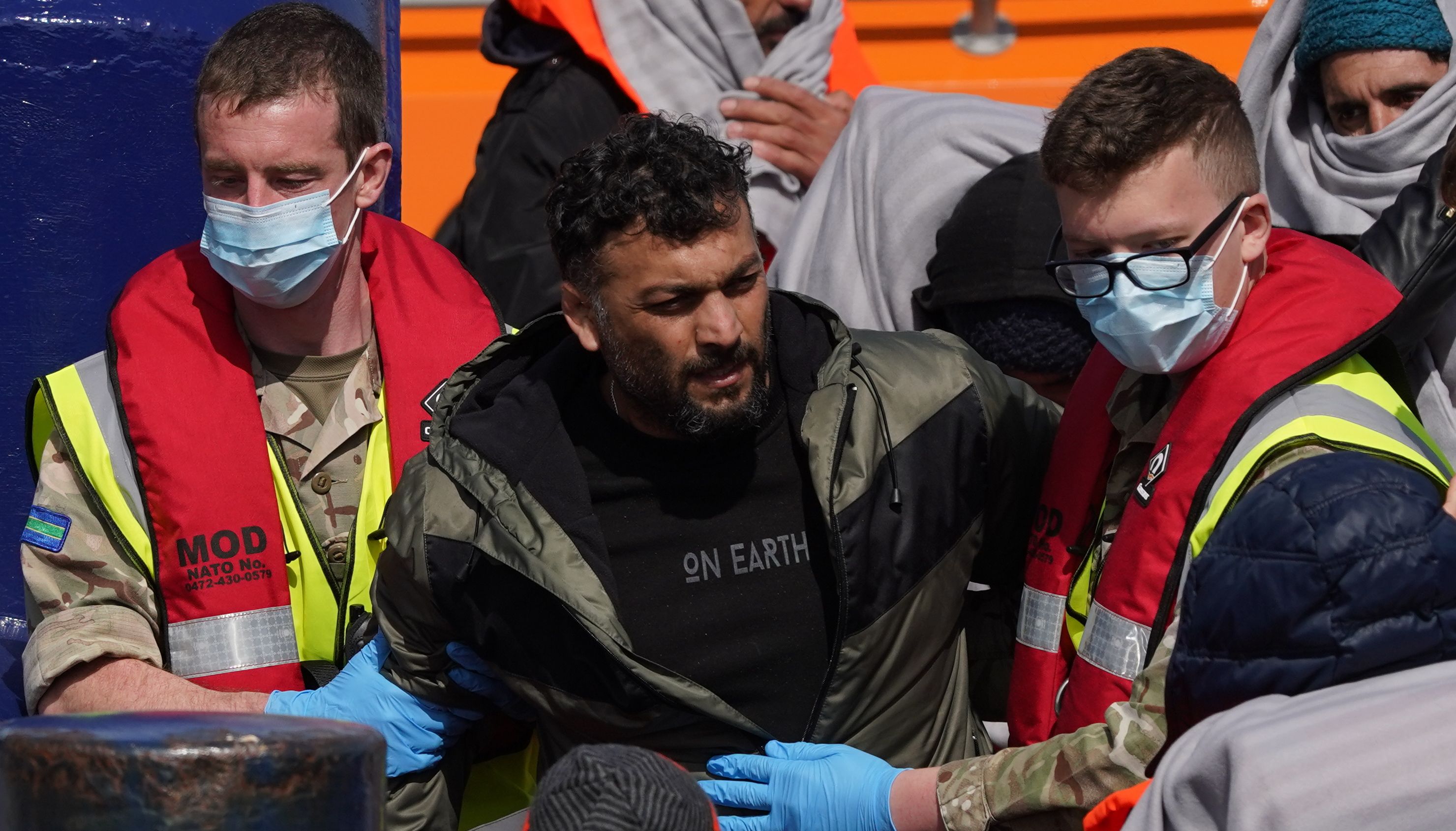 A group of people thought to be migrants are brought in to Dover, Kent