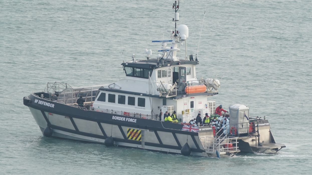 A group of people thought to be migrants are brought in to Dover, Kent