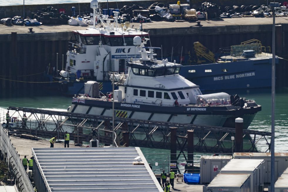A group of people thought to be migrants are brought in to Dover, Kent